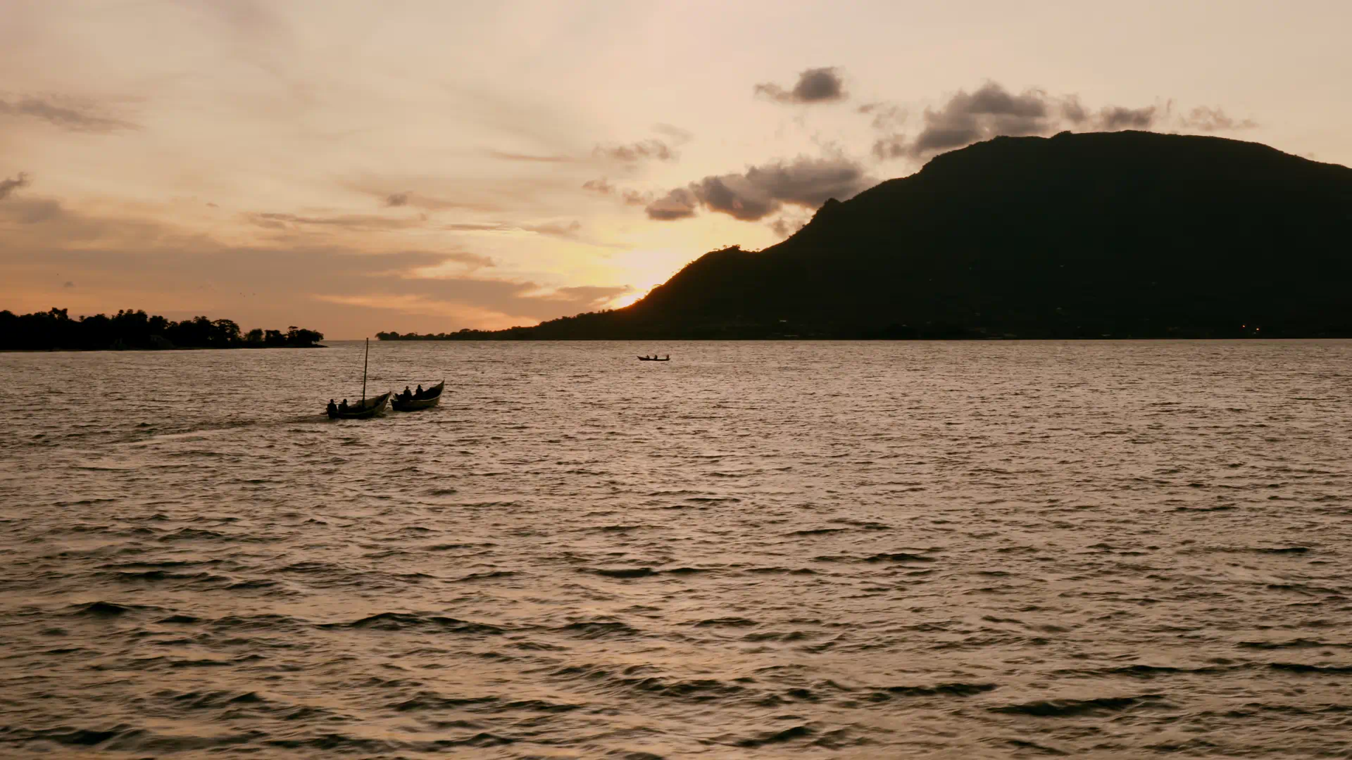 Fishermen going fishing in the sunset in an island in the Lake Victoria, Kenya