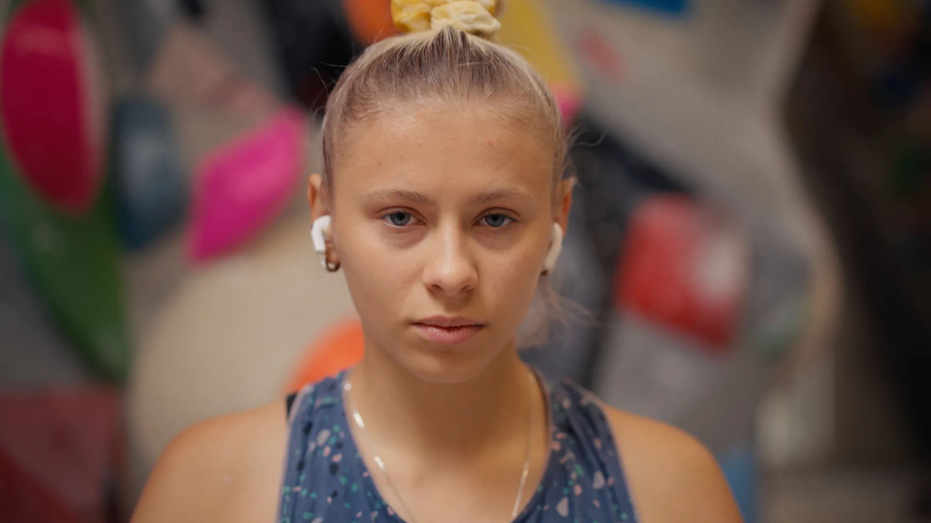 A portrait of Nika Potapova focused, staring at the camera